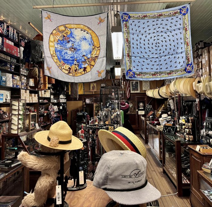 Scarves and a Since 1912 Delta Colorado cap displayed inside Davis Clothing Company