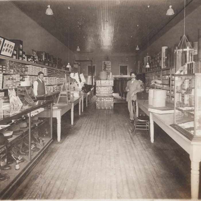 Historic sepia photograph of the Davis Clothing Company store interior in its early years